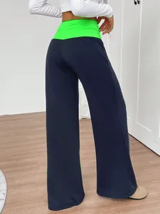High-waisted wide-leg yoga pants with neon green patchwork waistband