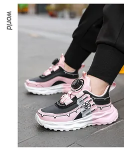 Detailed view of kids sports shoes with a rotary buckle and pink breathable mesh
