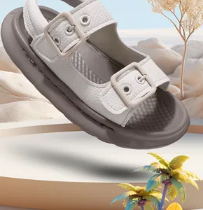 Detail of kids white leather-textured sandals with soft thick soles for summer beach