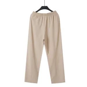 Full view of men's beige cotton linen casual trousers with elastic waist on a hanger