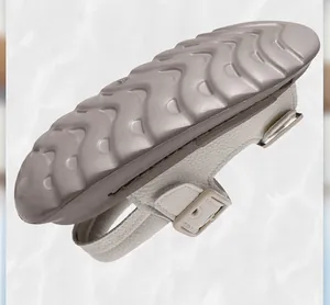 Detail view of lightweight children's sandals showing textured soft sole and adjustable buckles.