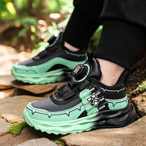 Breathable boys mesh running shoes featuring a stylish black and green rotating buckle design