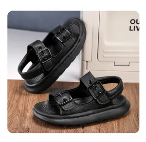 Close-up of black children's sandals with double buckles and a soft cushioned sole.