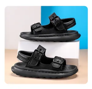 Detailed side view of black children's open-toe sandals with double buckle straps