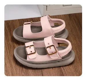Detailed view of pink children's leisure sandals featuring soft soles and gold buckles.