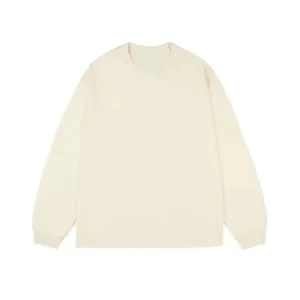 Detailed front view of a minimalist cream-colored long-sleeve cotton t-shirt for men
