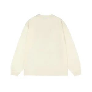 Clean back view of a minimalist cream-colored men's long-sleeve t-shirt base layer