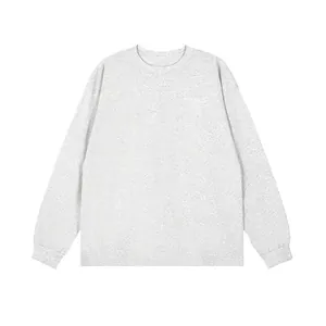 Front view of a minimalist heather grey long sleeve cotton t-shirt for men with round neck
