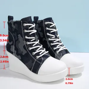Detailed view of women's camouflage wedge canvas sneakers with height measurements