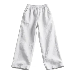 Detailed view of white breathable linen pants with drawstring and textured fabric.