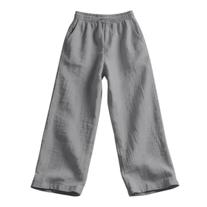Detailed view of the grey crinkle gauze fabric texture on these men's loose casual trousers