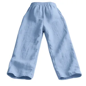 Close-up view of light blue men's loose linen trousers with elastic waist