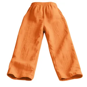 Detailed macro view of orange men's loose linen casual pants featuring a comfortable elastic waist