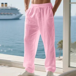 Detail view of pink linen trousers for men featuring a comfortable drawstring waist design.