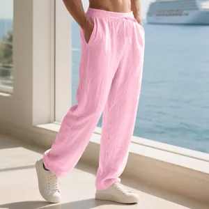 Close-up view of pink men's loose linen casual trousers with adjustable drawstring waist