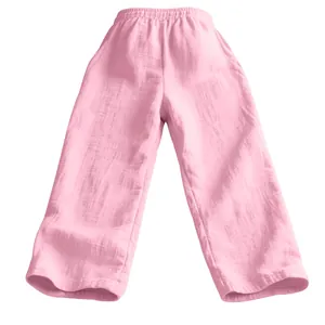 Detail view of pink textured linen pants with elastic waist and breathable fabric.