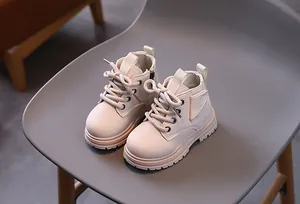 Stylish cream children's Martin boots with a classic British style for little boys and girls.
