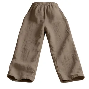 Close-up of brown textured linen casual pants showing breathable gauze fabric quality