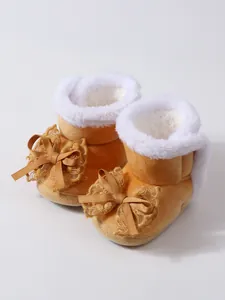 Gemütliche gelbe Baby-Lauflernstiefel mit weicher rutschfester Sohle und Schleifen
