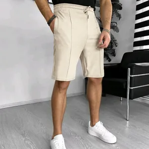 Men's beige waffle knit shorts on model showcasing the breathable summer texture