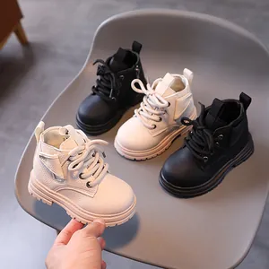 British style low-top Martin boots for toddlers in black and off-white colors