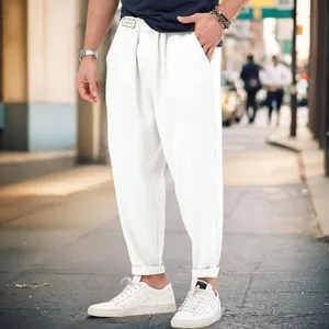 Detail shot of men's white sports casual harem pants with a stylish dropped crotch.