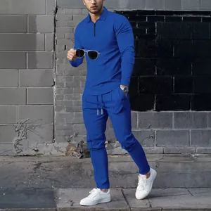 Modern men's blue waffle knit tracksuit featuring a zip polo top and matching pants