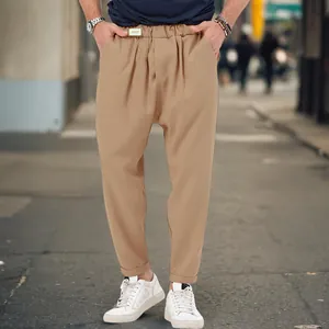 Men's khaki drop crotch harem pants in streetwear style with an elastic waistband