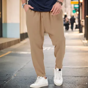 Men's trendy khaki drop-crotch harem pants in a stylish urban street casual look.