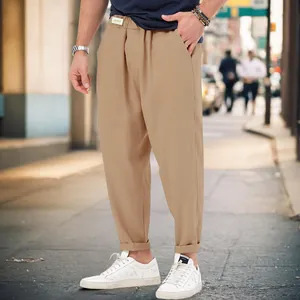 Close-up view of stylish khaki men's harem pants featuring a comfortable drop crotch design