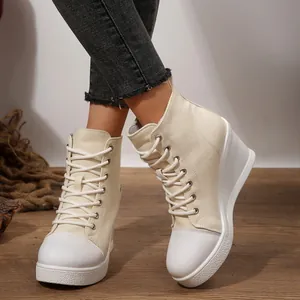 Detail view of stylish off-white women's high-top wedge canvas shoes with lace-up design