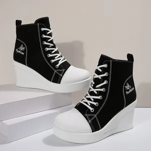 Stylish black and white women's wedge canvas sneakers with butterfly embroidery detail