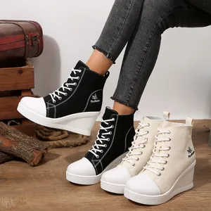 Fashionable lace-up canvas wedge boots for women, available in black and beige