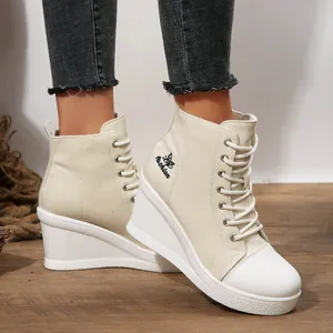 Stylish women's off-white wedge canvas shoes with lace-up design and butterfly embroidery