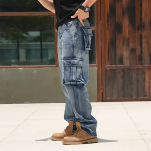 Detail view of men's blue wide-leg cargo denim jeans with multiple pockets and loose fit.