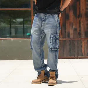 Close-up detail shot of men's loose wide-leg blue denim cargo jeans with multi-pockets.
