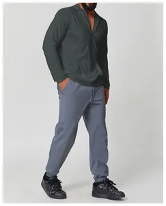 Men's athletic hooded sun protection shirt and joggers set shown in a studio side view
