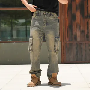 Detail shot of men's loose cargo jeans with distressed yellow-blue wash and large pockets