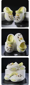 Multiple angles of white kids' summer clogs featuring cute yellow cartoon sheep charms