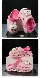 Side and top views of pink children's cartoon clogs with cloud character charms