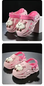 Close-up view of pink children's waterproof clogs with cute cartoon cloud character