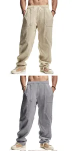 Minimalist loose-fit linen men's casual beach pants shown in khaki and gray colors