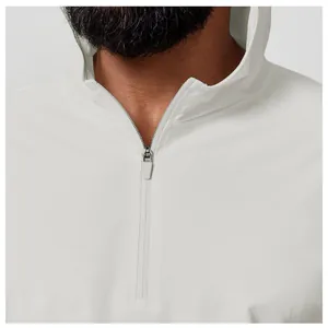 Close-up of the zipper and collar detail of a men's white athletic sun protection hoodie