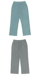 Pair of light blue and grey men's loose linen casual beach trousers with elastic waist.