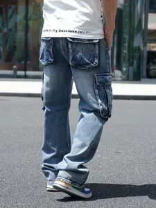 Back view of loose fit blue denim cargo pants with multi-pocket design