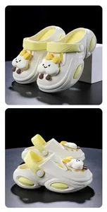 Detailed close-up view of white platform clogs featuring cute 3D cartoon cloud charms on the upper