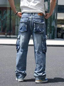 Close-up of blue multi-pocket cargo jeans for men with wide leg loose fit