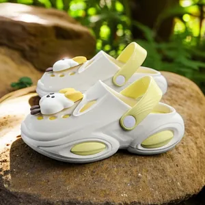 Comfortable cream chunky platform clogs with cute yellow duck charms for women outdoor wear