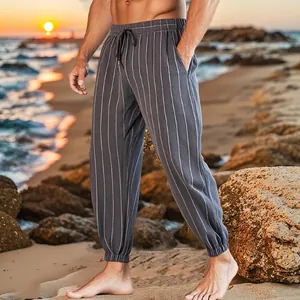 Close-up of men's casual striped linen trousers for summer beach wear and outdoor comfort