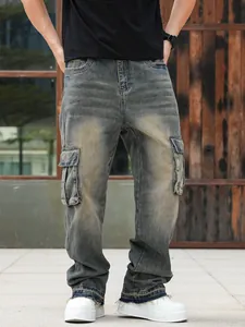 Close-up detail of loose-fit men's cargo jeans with side pockets and vintage wash